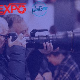 photographer shooting with a camera and telephoto lens